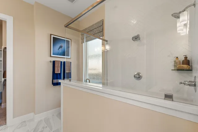 a bathroom with a bathtub and a shower