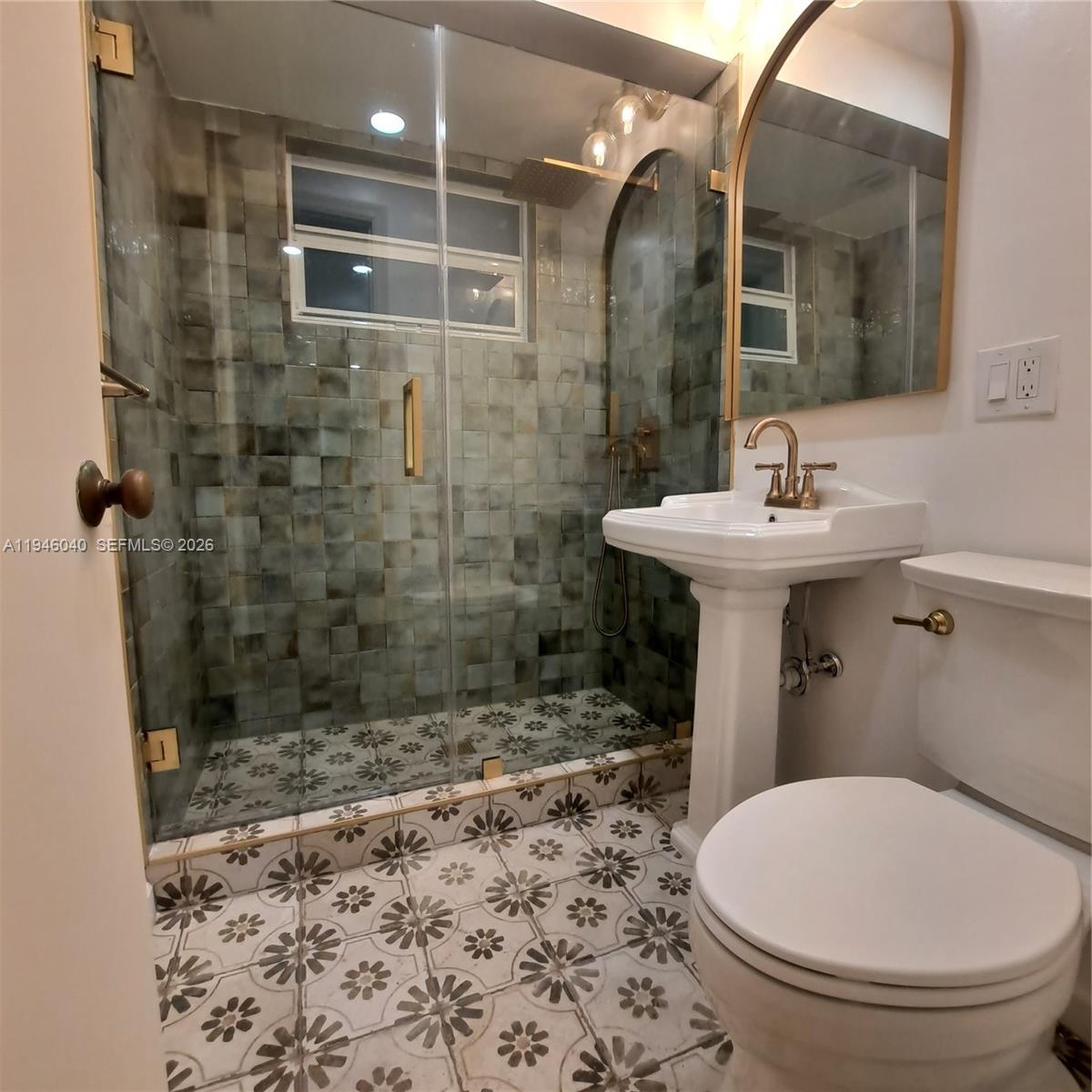 5840 Southwest 51st Street Miami, FL 33155 - Photo 9 of 15 a bathroom with a sink toilet and shower