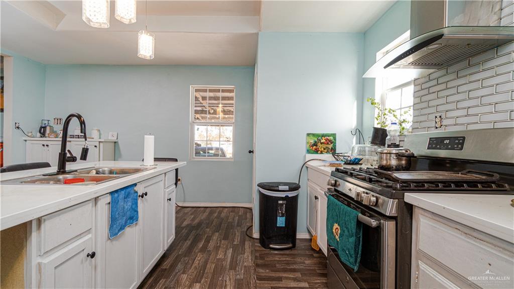 313 Eva Street Edcouch, TX 78538 - Photo 3 of 17 a kitchen with a stove and a sink