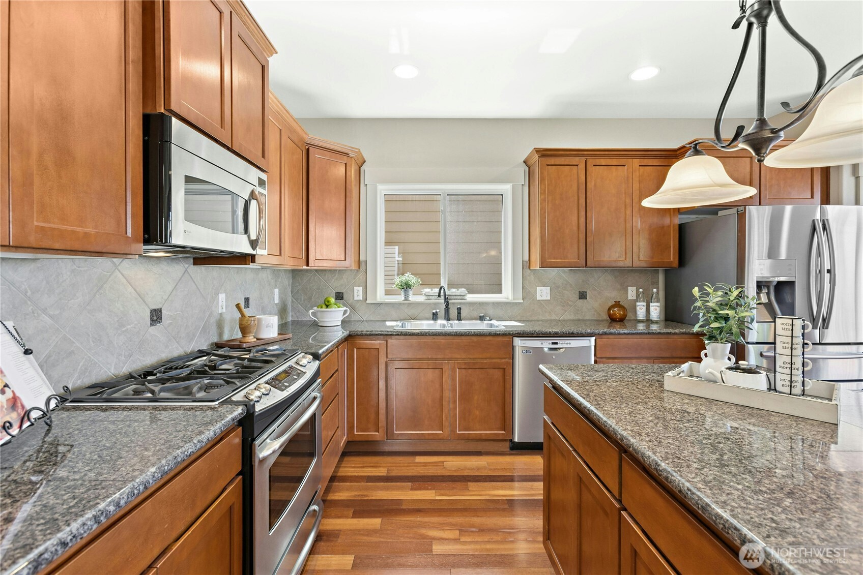 22624 43rd Drive Southeast Bothell, WA 98021 - Photo 8 of 36 a kitchen with granite countertop a sink a counter space appliances and cabinets