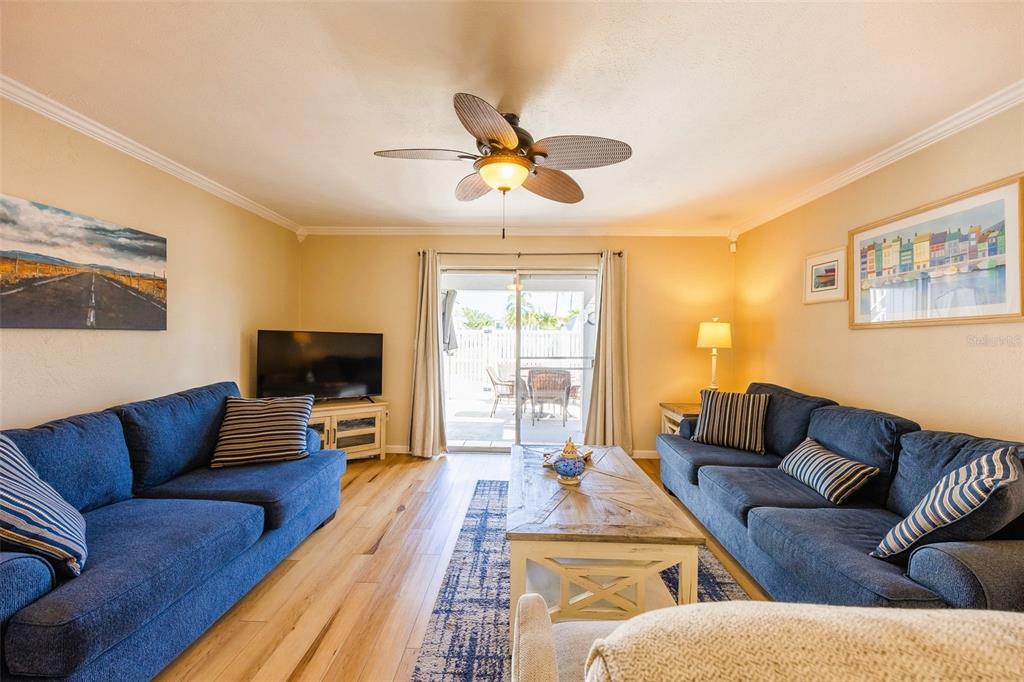 6777 Winkler Road, Unit 150 Fort Myers, FL 33919 - Photo 14 of 48 a living room with furniture and a flat screen tv