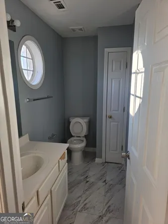 a bathroom with a sink and a toilet