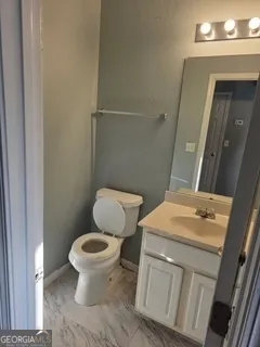 a bathroom with a sink and a toilet