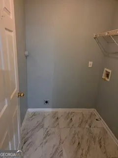 a bathroom with a toilet sink and a shower