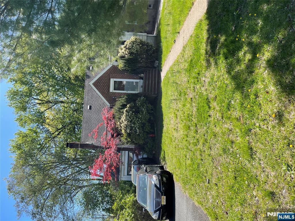 504 High Street Closter, NJ 07624 - Photo 3 of 3 a front view of house with yard and trees