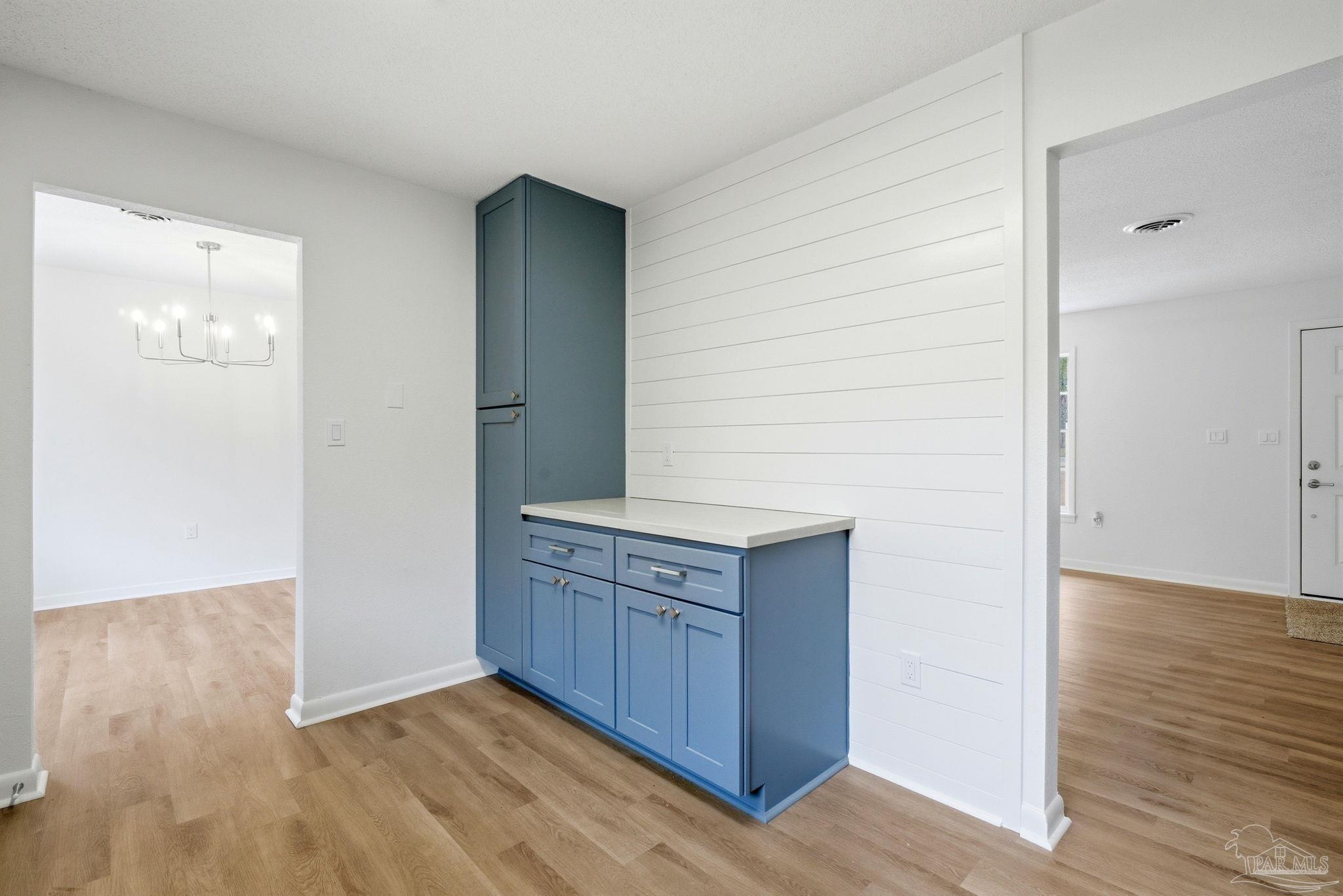 6534 Berryhill Road Milton, FL 32570 - Photo 12 of 38 a view of cabinets and wooden floor