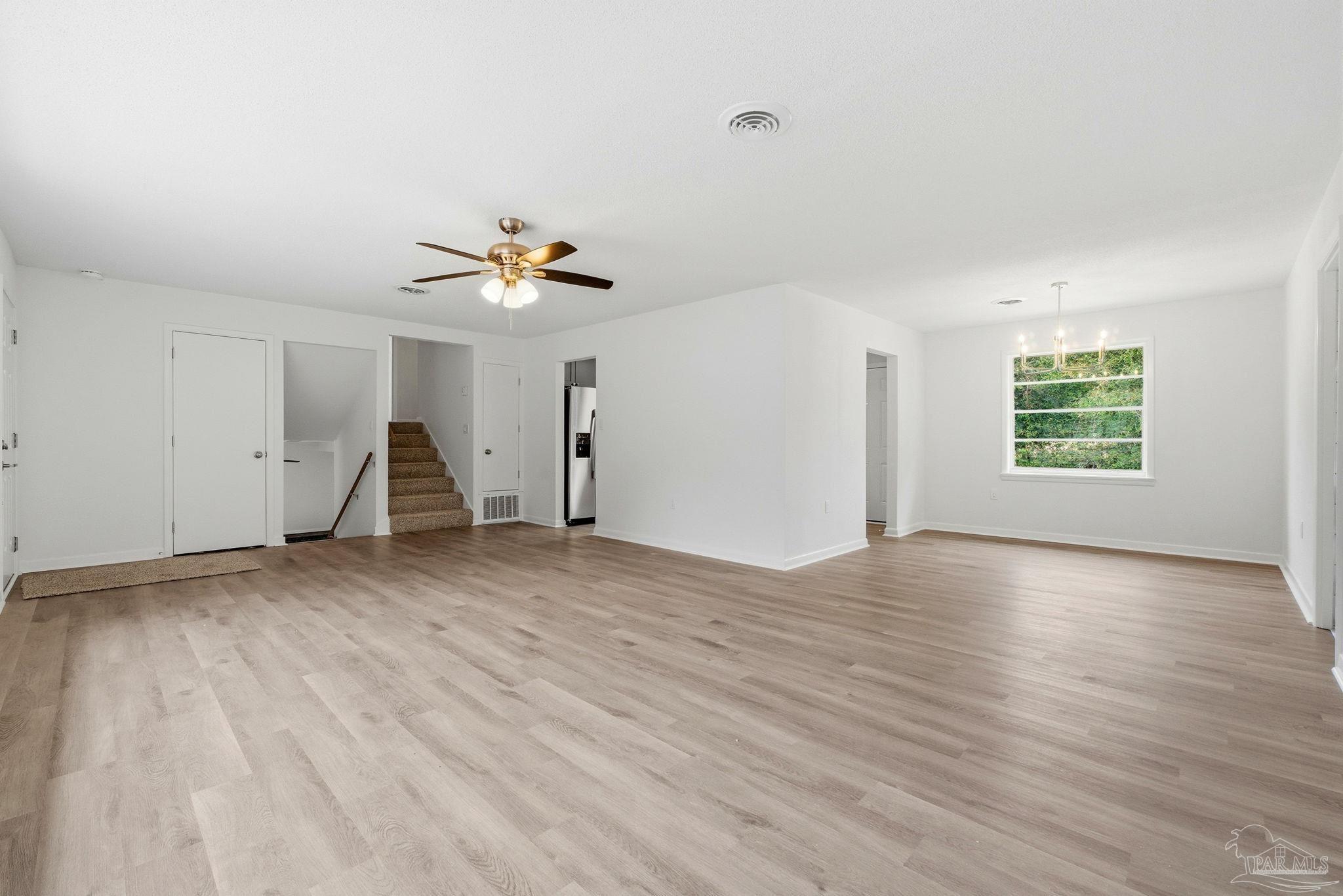 6534 Berryhill Road Milton, FL 32570 - Photo 16 of 38 wooden floor in an empty room with a window