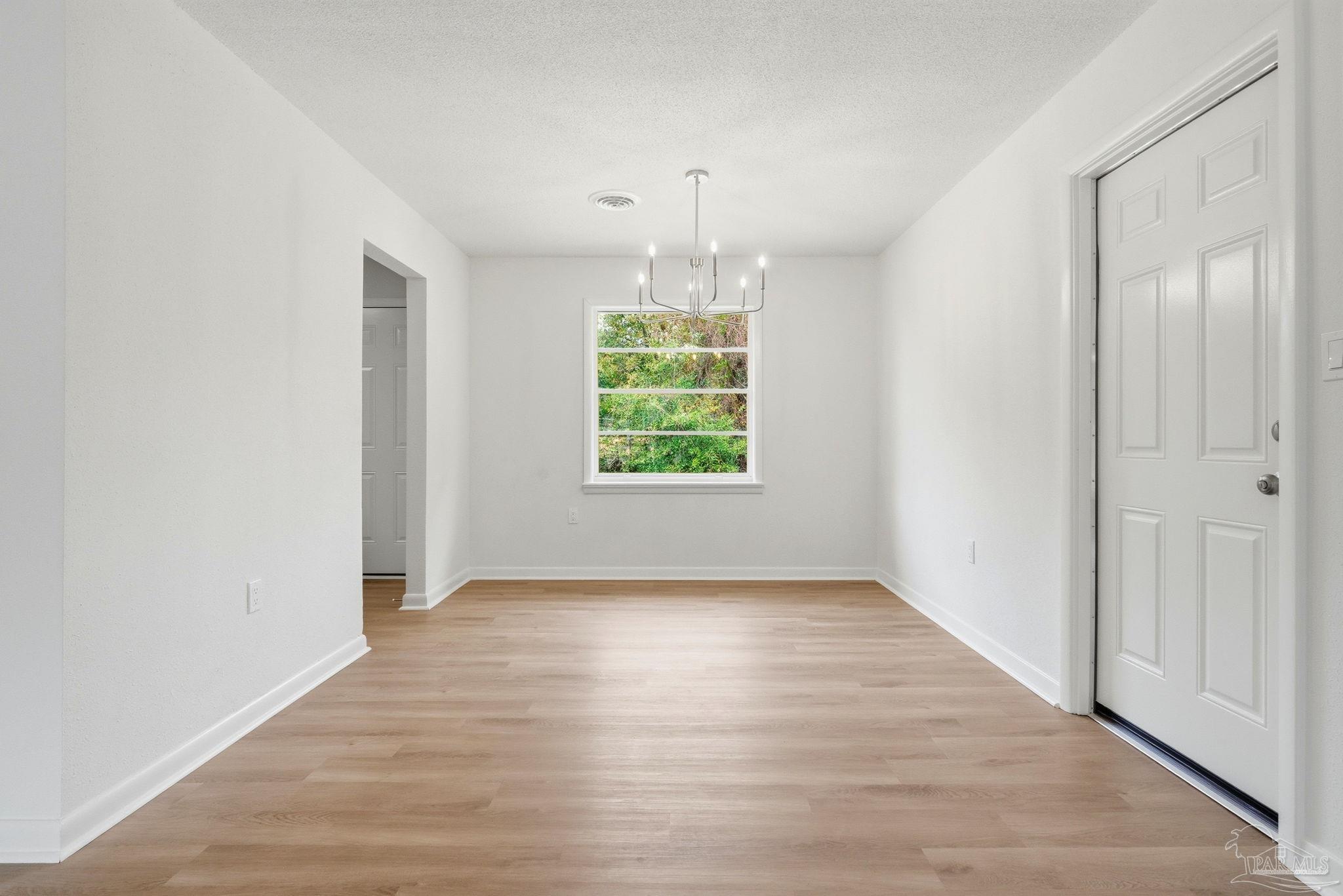 6534 Berryhill Road Milton, FL 32570 - Photo 18 of 38 an empty room that has a window in it