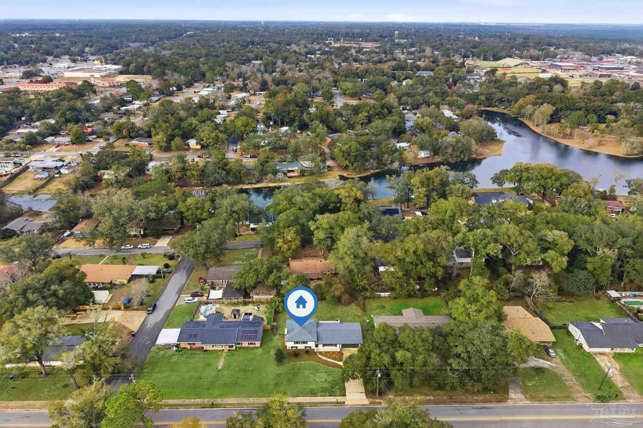 6534 Berryhill Road Milton, FL 32570 - Photo 2 of 38 an aerial view of residential building with green space