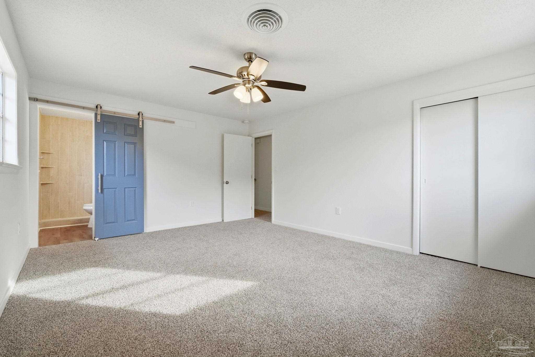 6534 Berryhill Road Milton, FL 32570 - Photo 27 of 38 a view of empty room with ceiling fan
