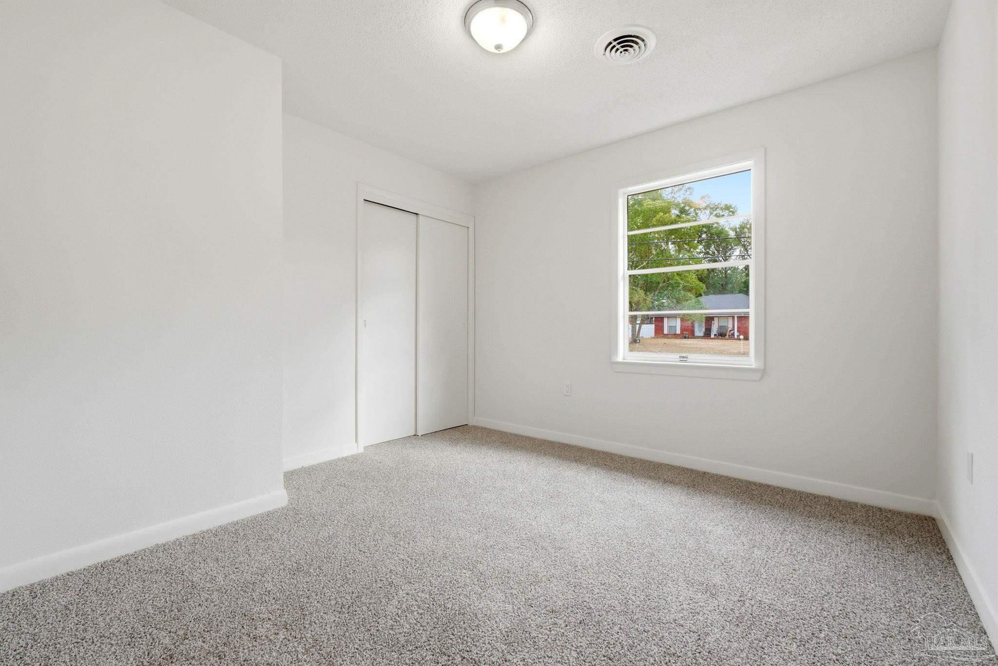 6534 Berryhill Road Milton, FL 32570 - Photo 29 of 38 an empty room with windows