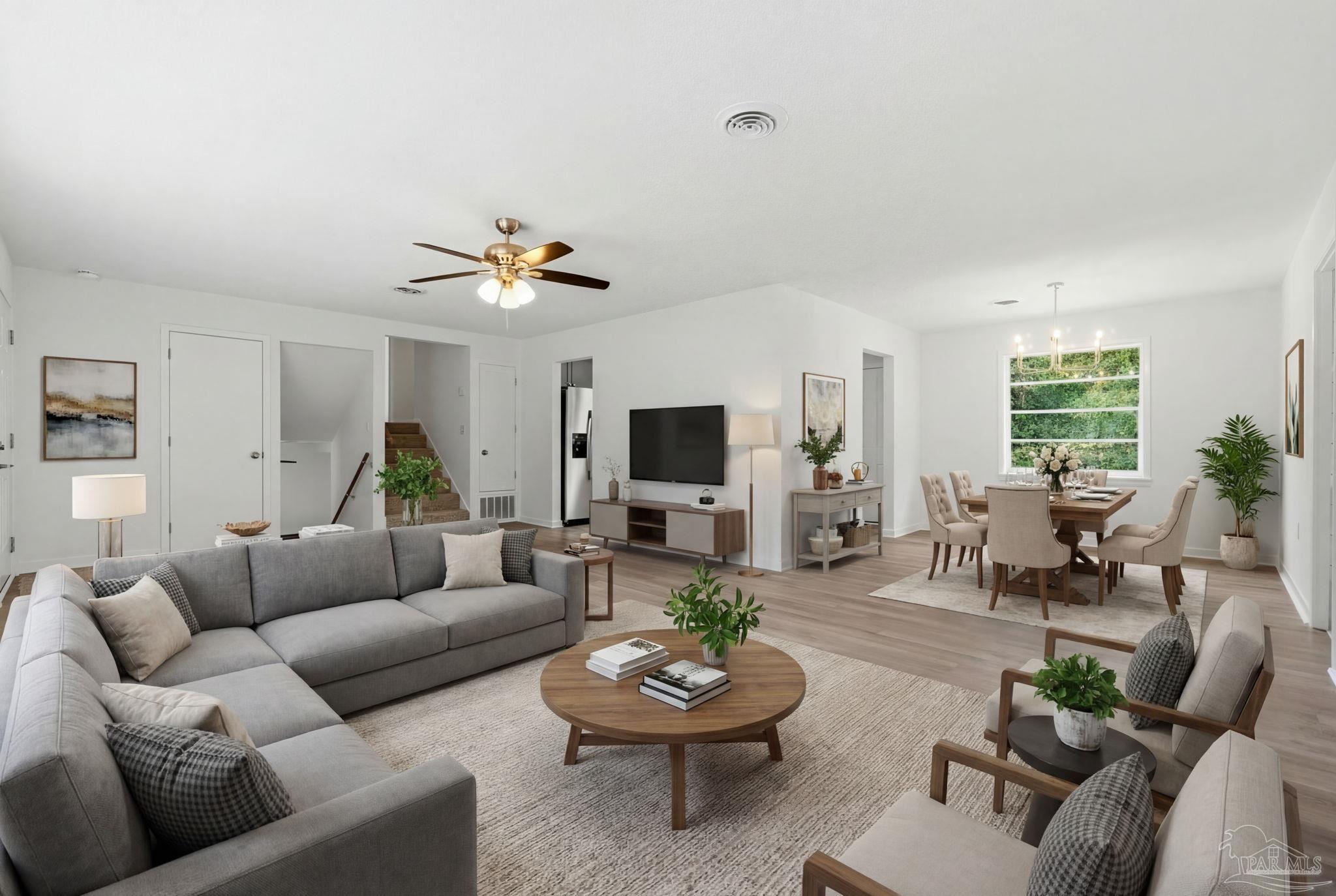 6534 Berryhill Road Milton, FL 32570 - Photo 3 of 38 a living room with furniture and a large window