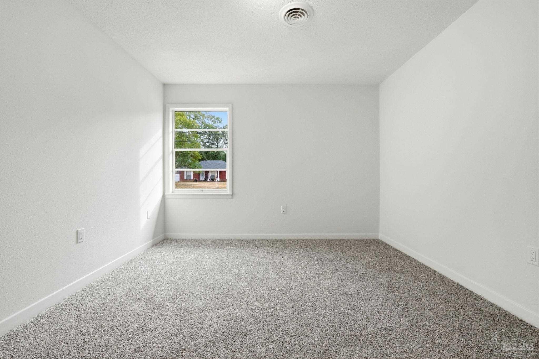 6534 Berryhill Road Milton, FL 32570 - Photo 31 of 38 a view of an empty room with a window