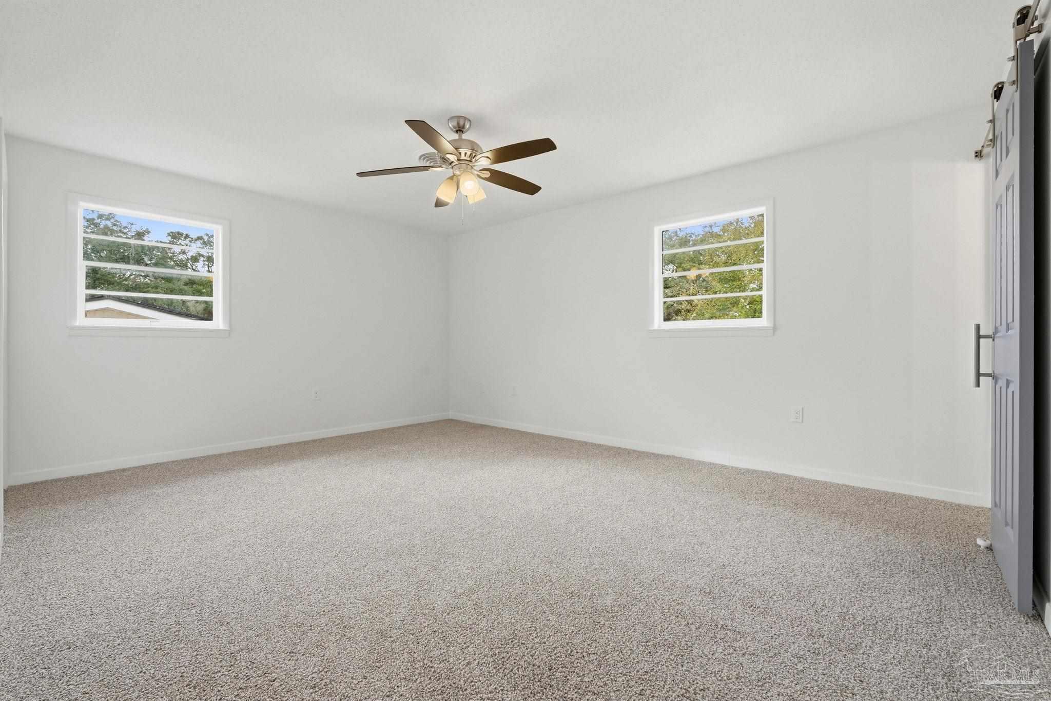 6534 Berryhill Road Milton, FL 32570 - Photo 33 of 38 a view of an empty room with a window