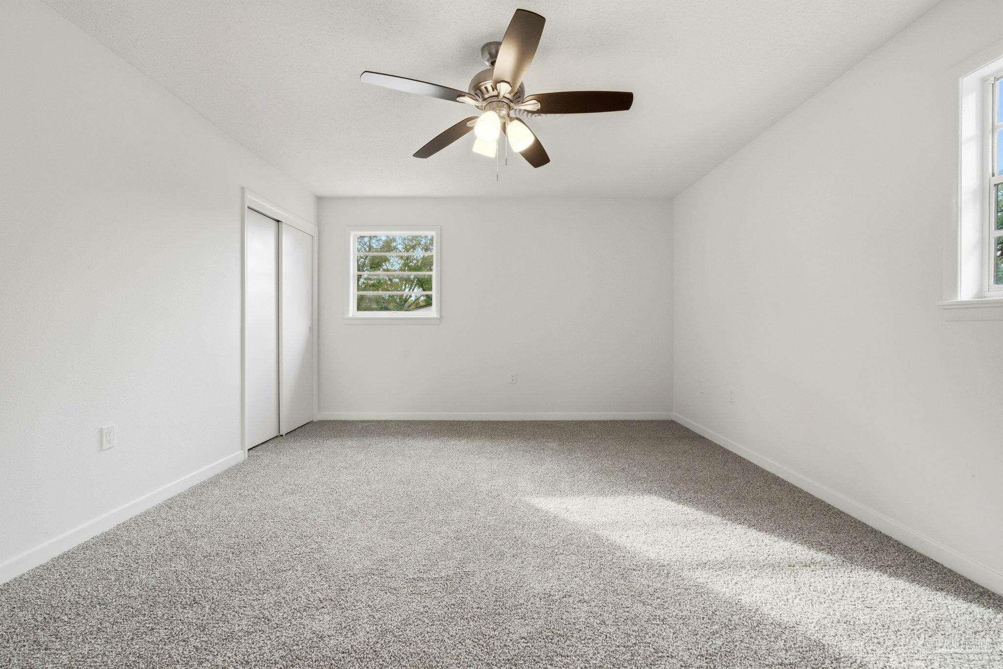 6534 Berryhill Road Milton, FL 32570 - Photo 34 of 38 an empty room with a window and a fan