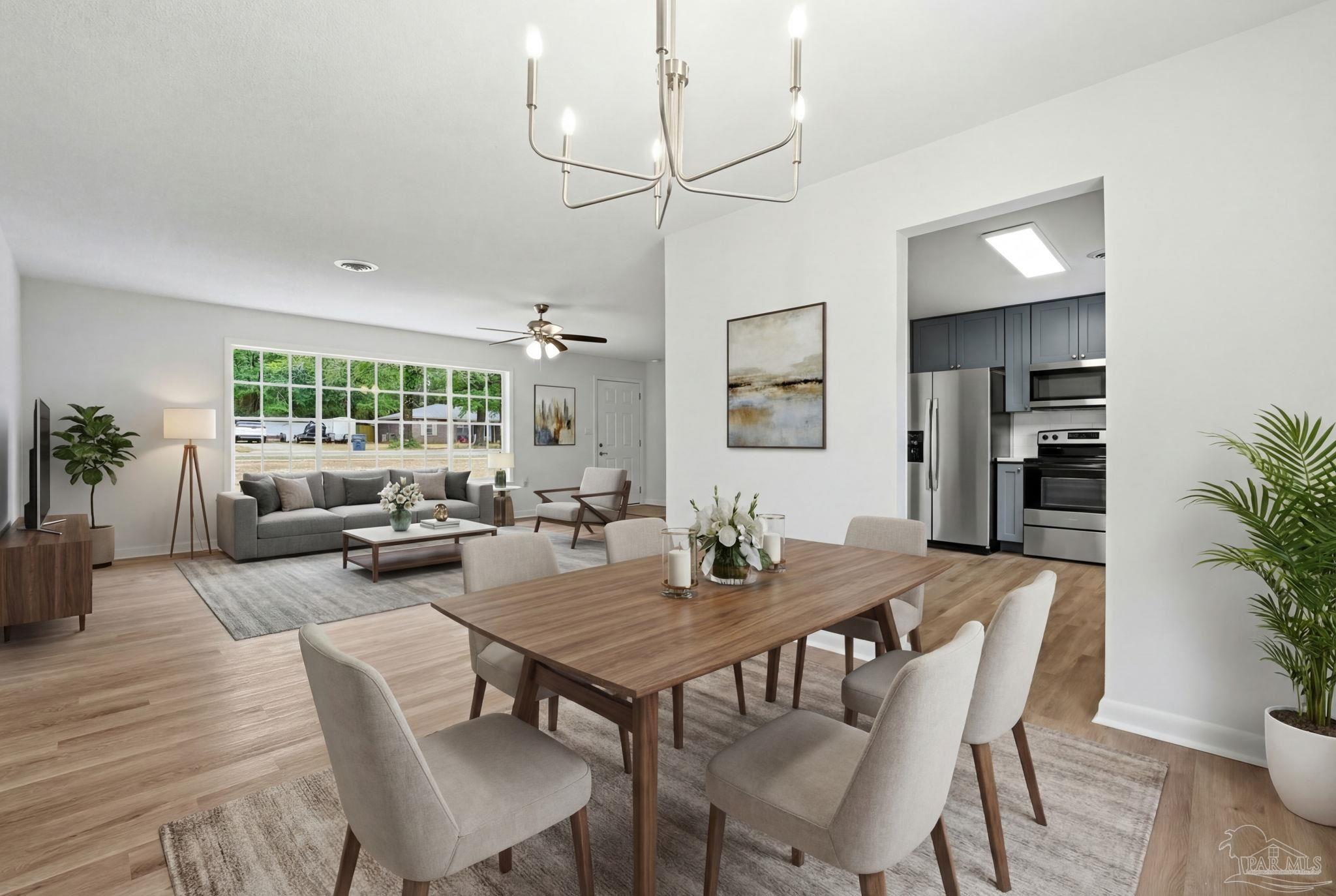 6534 Berryhill Road Milton, FL 32570 - Photo 4 of 38 a view of a dining room with furniture