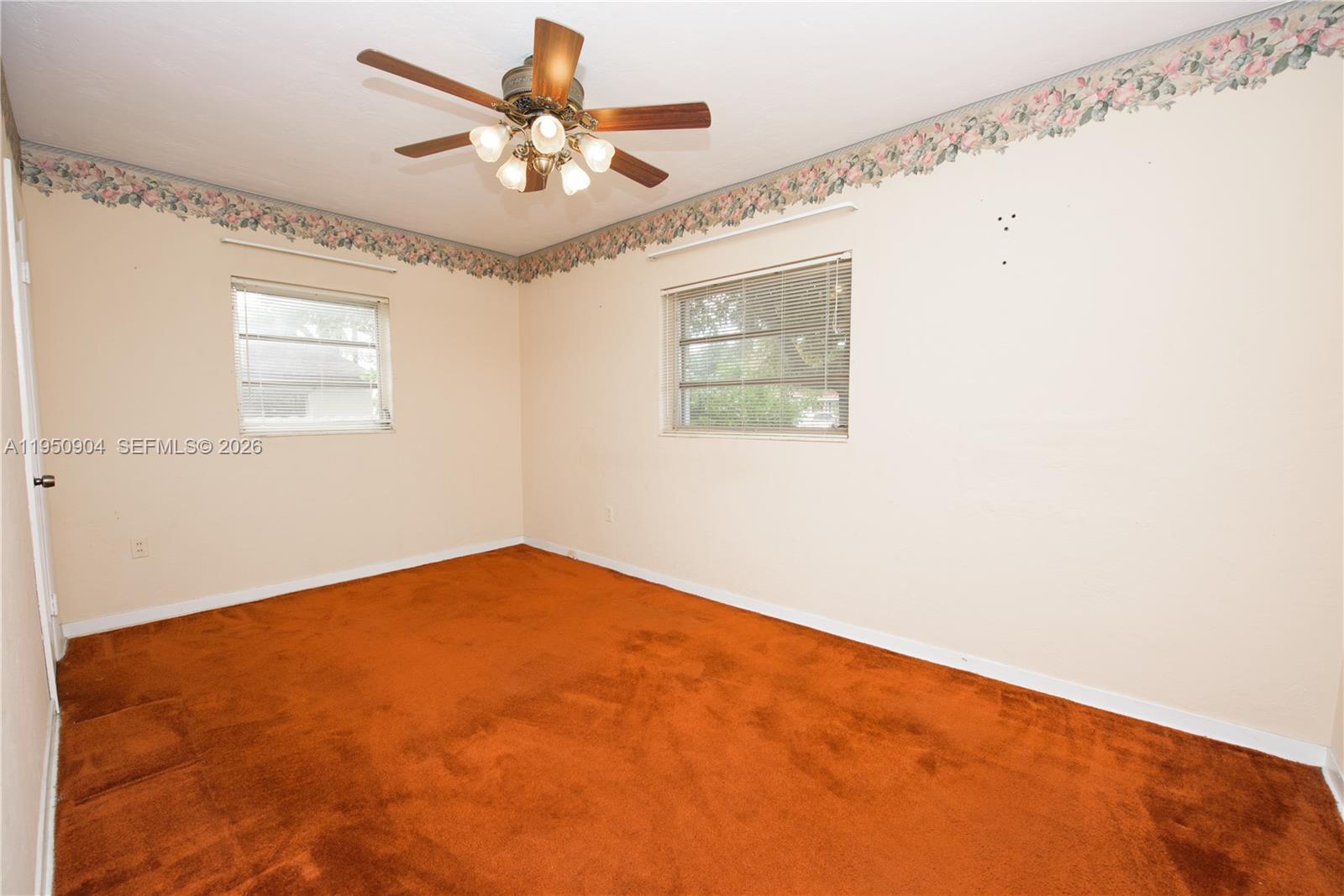 5431 West 2nd Avenue Hialeah, FL 33012 - Photo 11 of 24 a view of an empty room with a window