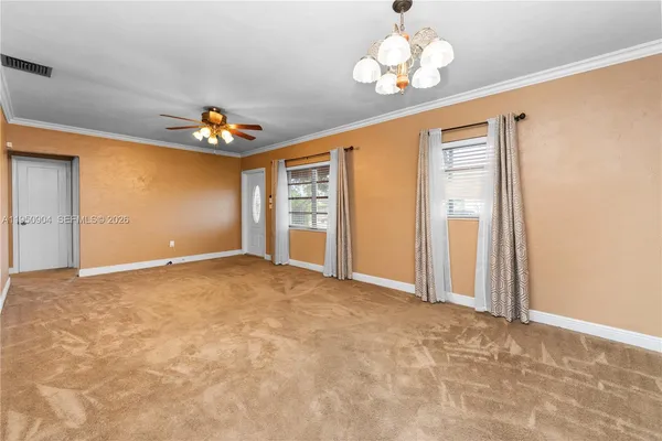 a view of an empty room with a window