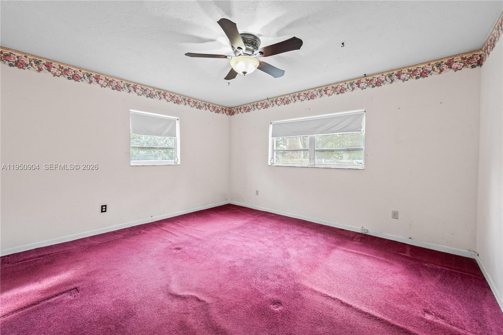 5431 West 2nd Avenue Hialeah, FL 33012 - Photo 7 of 24 a view of an empty room with a window