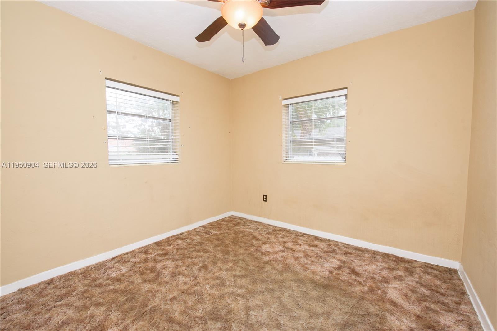 5431 West 2nd Avenue Hialeah, FL 33012 - Photo 9 of 24 a view of an empty room with a window