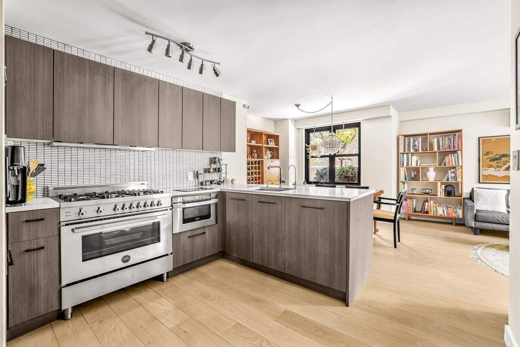 175 West 95th Street, Unit 2C Manhattan, NY 10025 - Photo 3 of 18 a kitchen with a stove and a window
