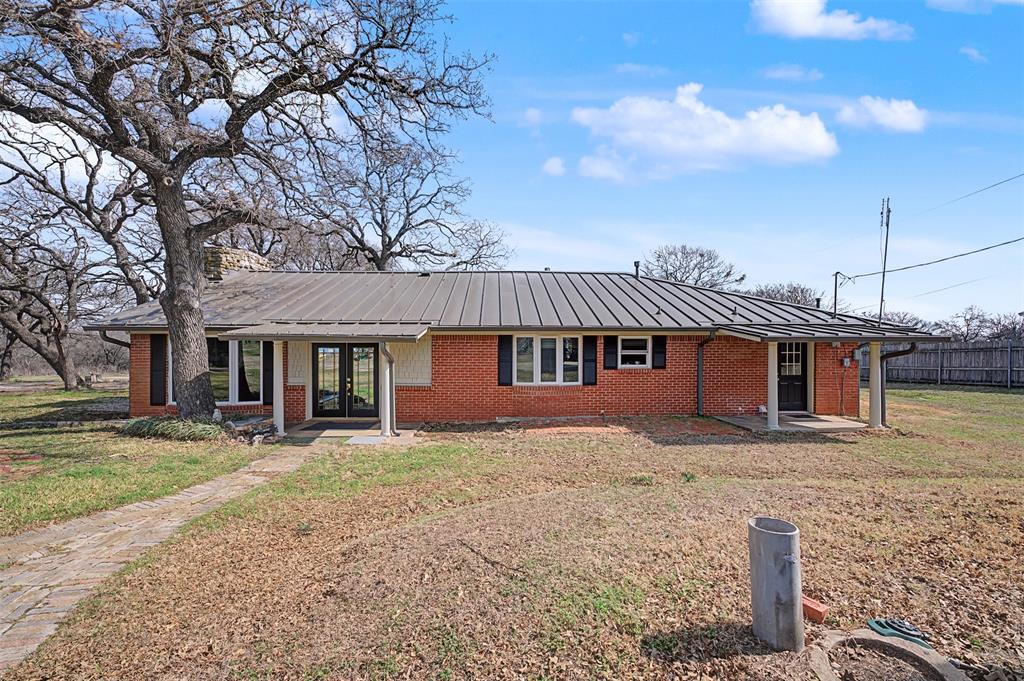 8240 Kramer Street Burleson, TX 76028 - Photo 31 of 39 a front view of a house with garden