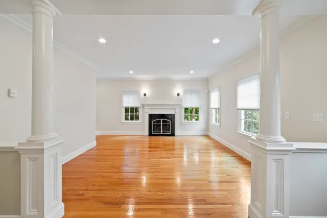 a view of a livingroom with a fireplace a fireplace and window