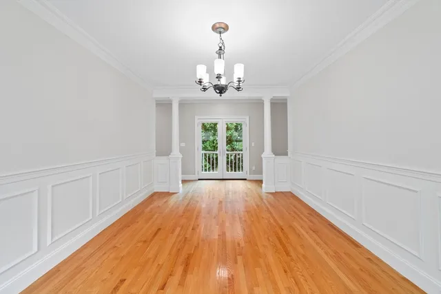a kitchen with stainless steel appliances granite countertop a sink a stove and a wooden floors