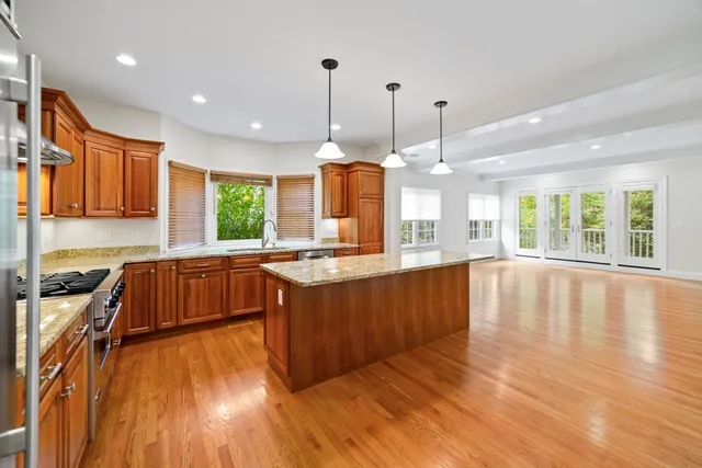 a view of a kitchen with furniture and a fireplace