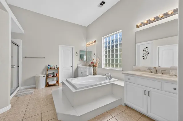 a living room with furniture and a sink