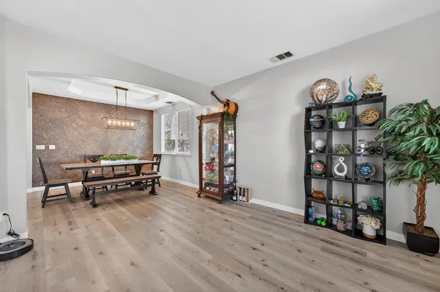 a living room filled with furniture and wooden floor