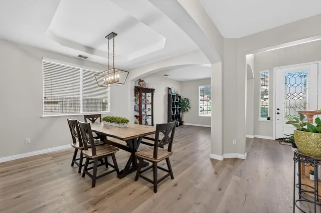 a view of a dining room with furniture window and wooden floor