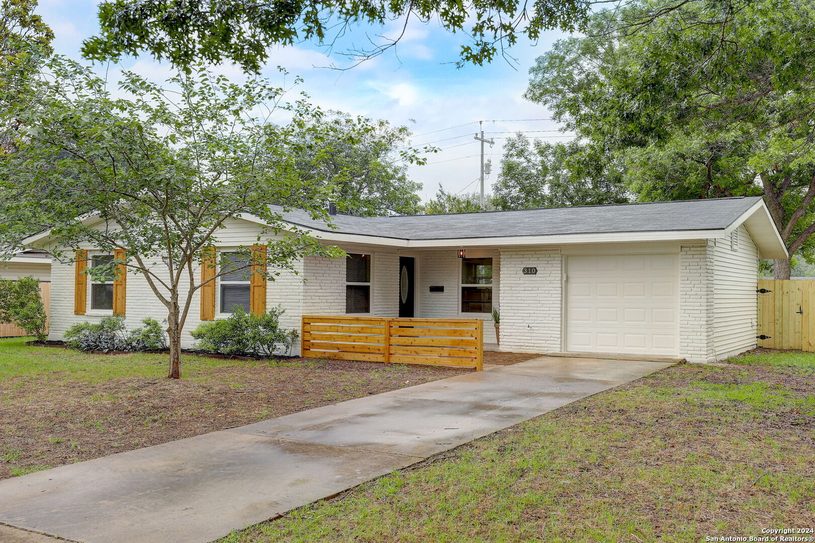 310 Maple Drive Schertz, TX 78154 - Photo 1 of 1 a front view of house with yard and trees around