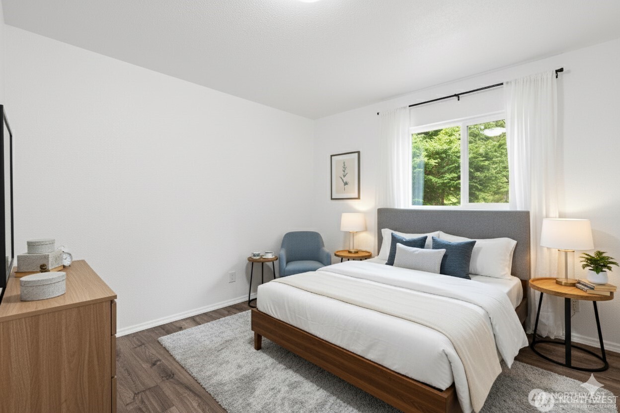 2693 Highway 101 Long Beach, WA 98631 - Photo 19 of 31 a bedroom with a bed and a window