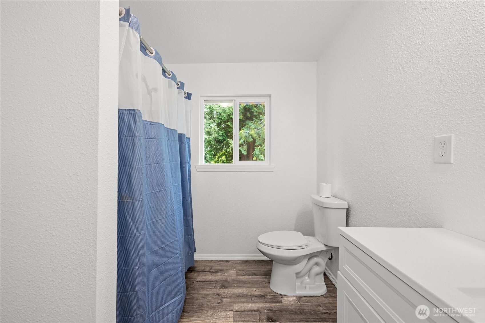 2693 Highway 101 Long Beach, WA 98631 - Photo 23 of 31 a white toilet sitting next to a bathroom sink