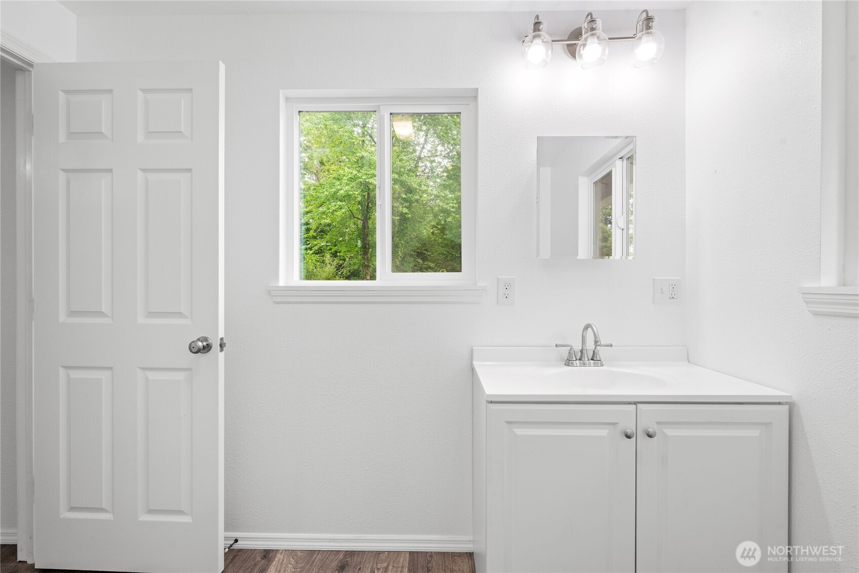 2693 Highway 101 Long Beach, WA 98631 - Photo 29 of 31 a bathroom with a sink toilet and vanity