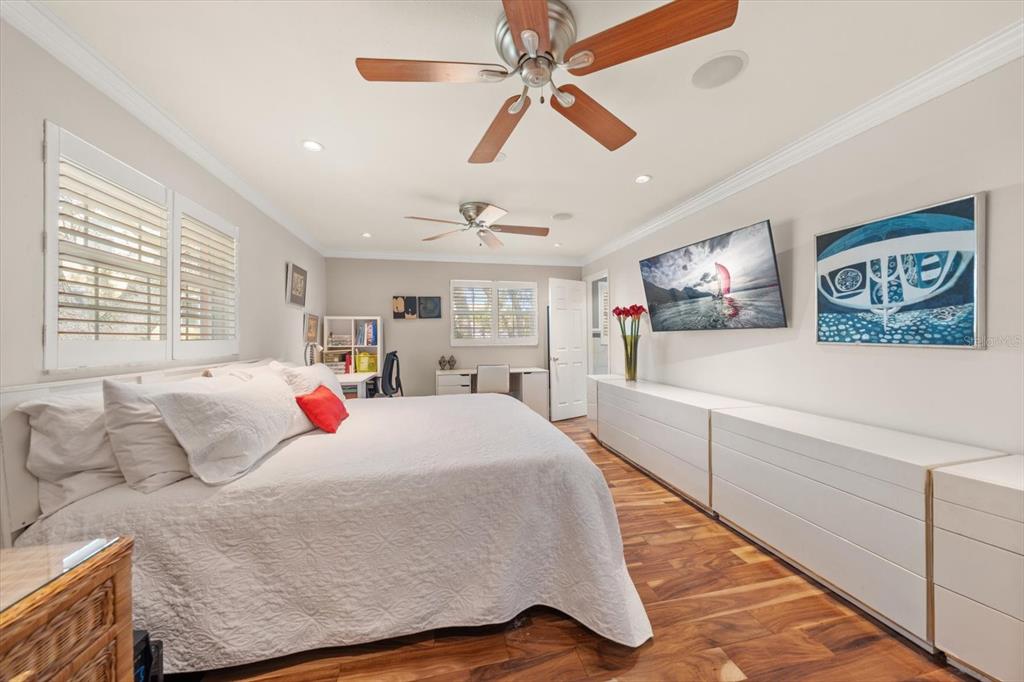 1921 Cardinal Road Dunedin, FL 34698 - Photo 21 of 52 a bed room with a bed and a large window
