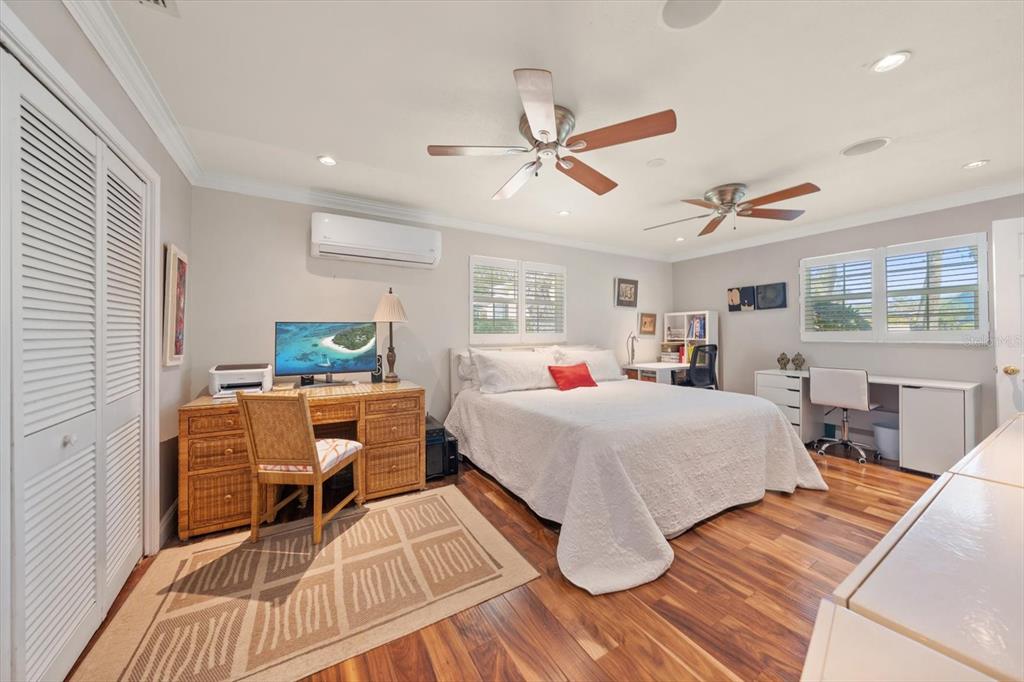 1921 Cardinal Road Dunedin, FL 34698 - Photo 22 of 52 a bedroom with a bed and a table