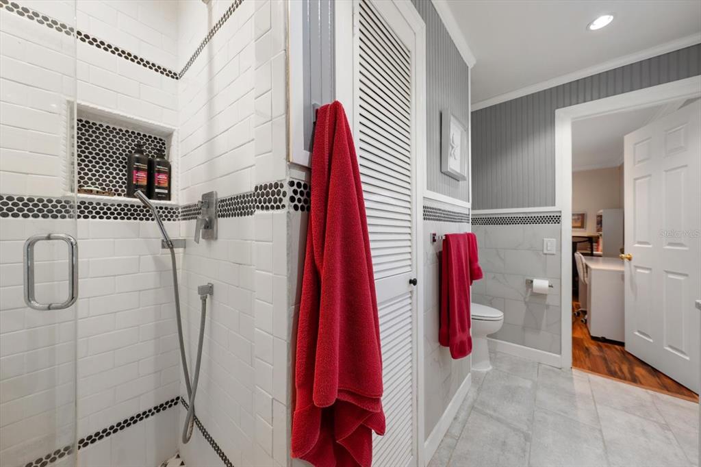 1921 Cardinal Road Dunedin, FL 34698 - Photo 25 of 52 a bathroom with a shower and a shower