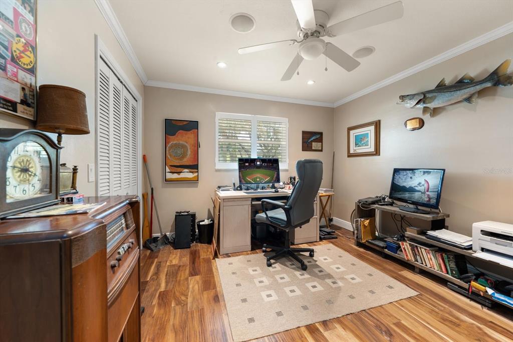 1921 Cardinal Road Dunedin, FL 34698 - Photo 31 of 52 a view of a workspace with furniture and a window