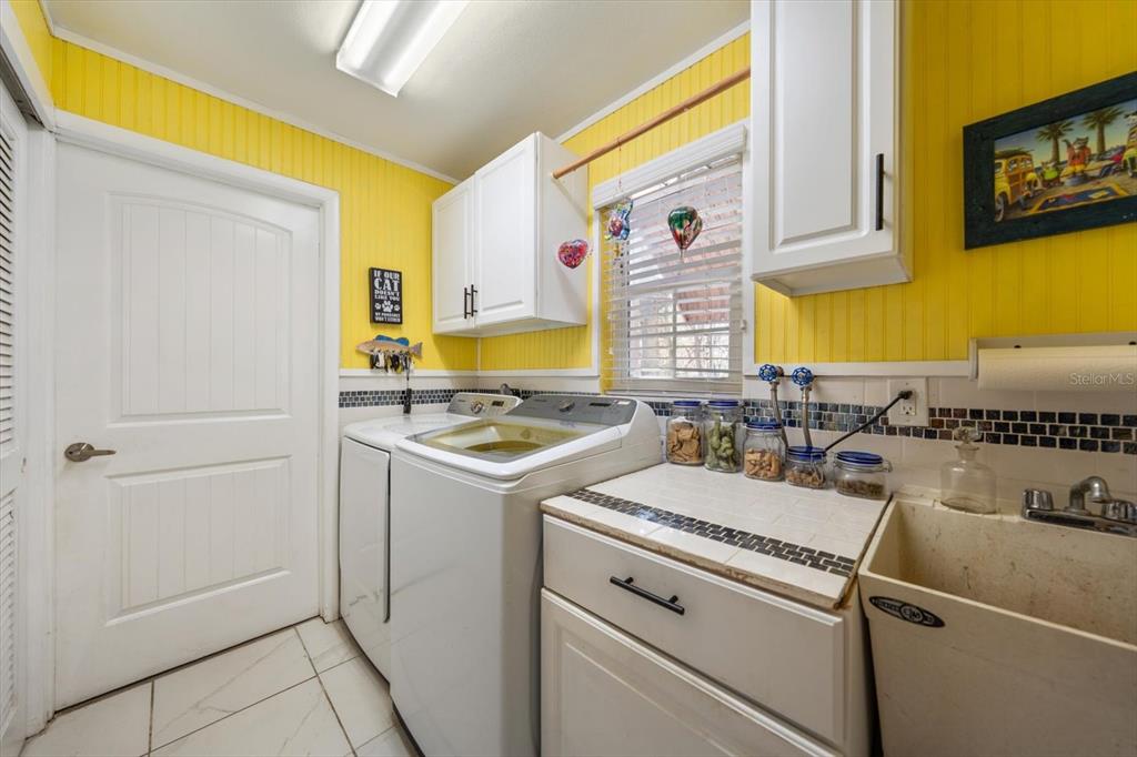1921 Cardinal Road Dunedin, FL 34698 - Photo 33 of 52 a view of a kitchen with sink and dishwasher