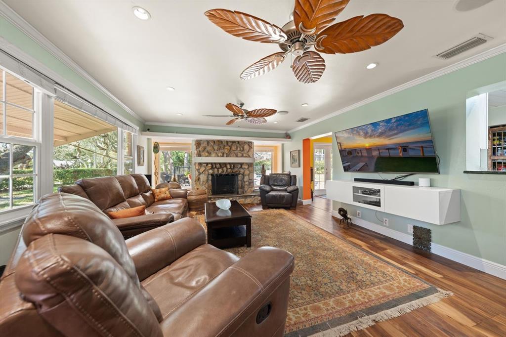 1921 Cardinal Road Dunedin, FL 34698 - Photo 5 of 52 a living room with furniture and a flat screen tv