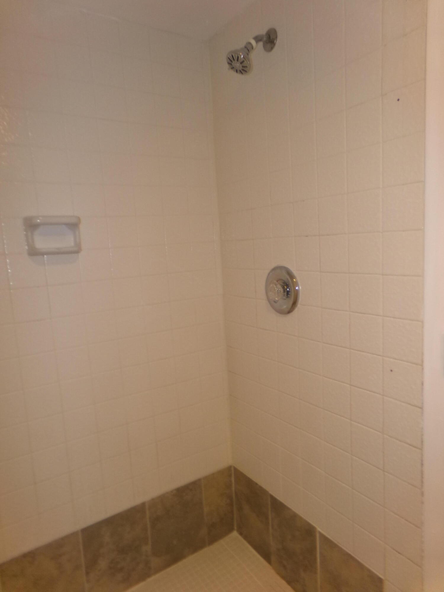 1514 Southeast Royal Green Circle, Unit I203 Port St. Lucie, FL 34952 - Photo 9 of 13 a bathroom with a shower