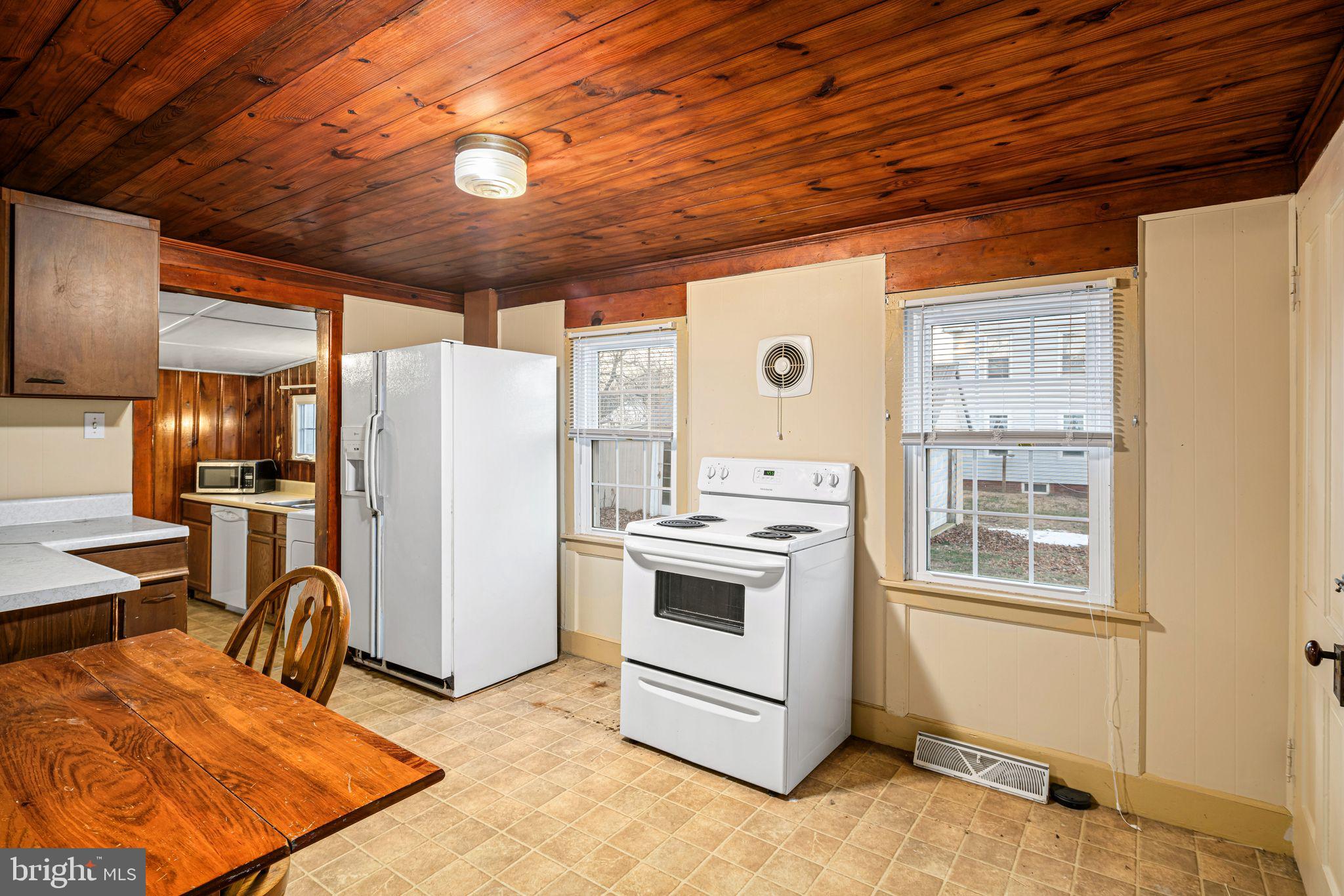 39 Main Street Pilesgrove, NJ 08098 - Photo 11 of 30 a view of a kitchen with refrigerator and stove