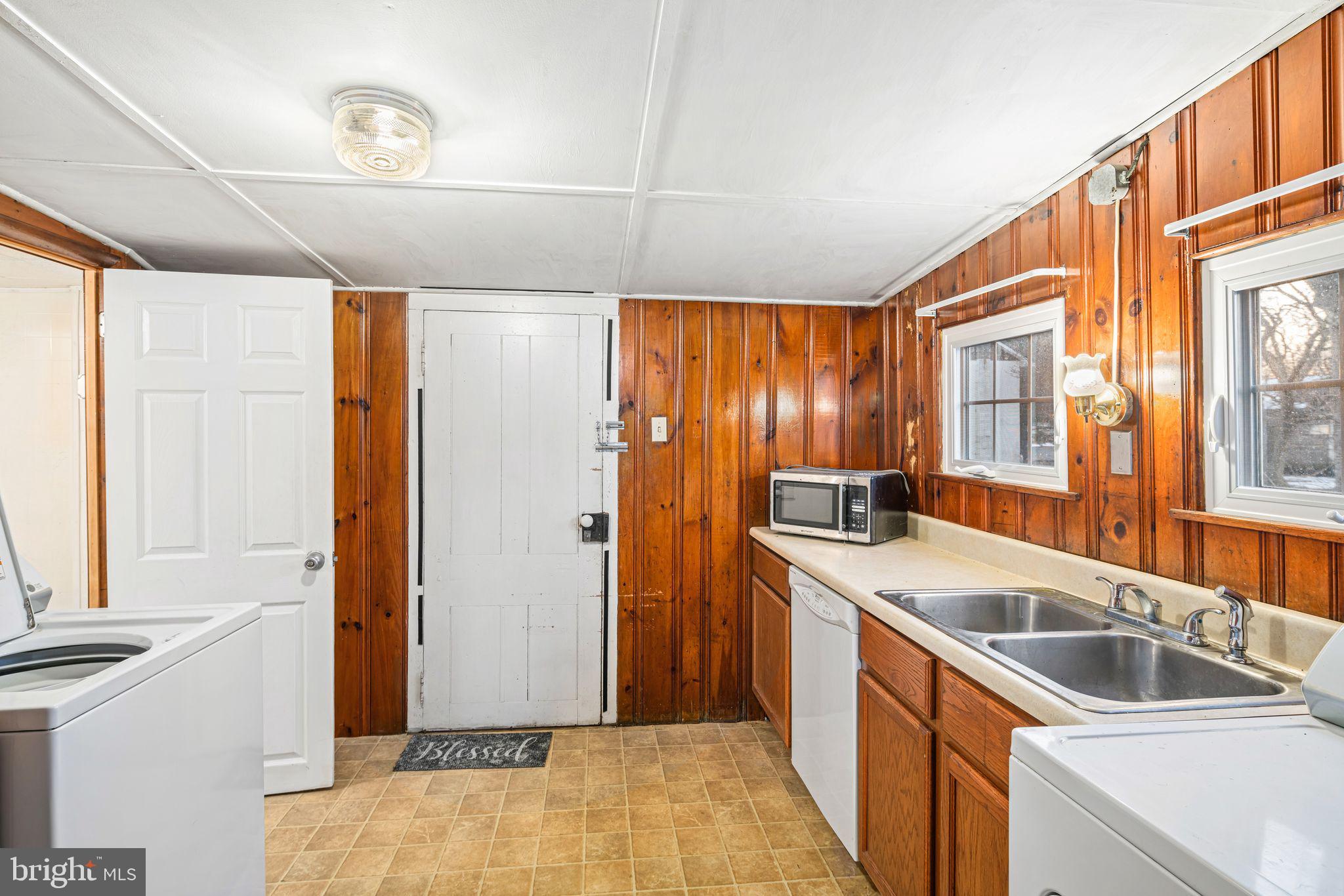 39 Main Street Pilesgrove, NJ 08098 - Photo 12 of 30 a kitchen that has a sink and a stove