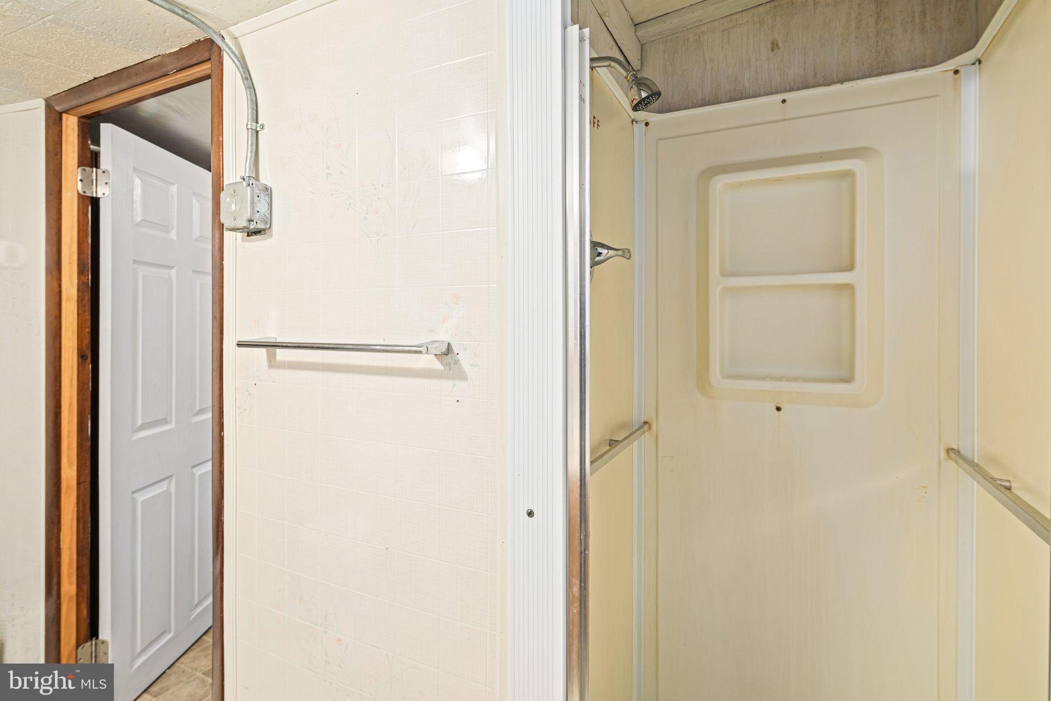 39 Main Street Pilesgrove, NJ 08098 - Photo 14 of 30 a bathroom with a shower
