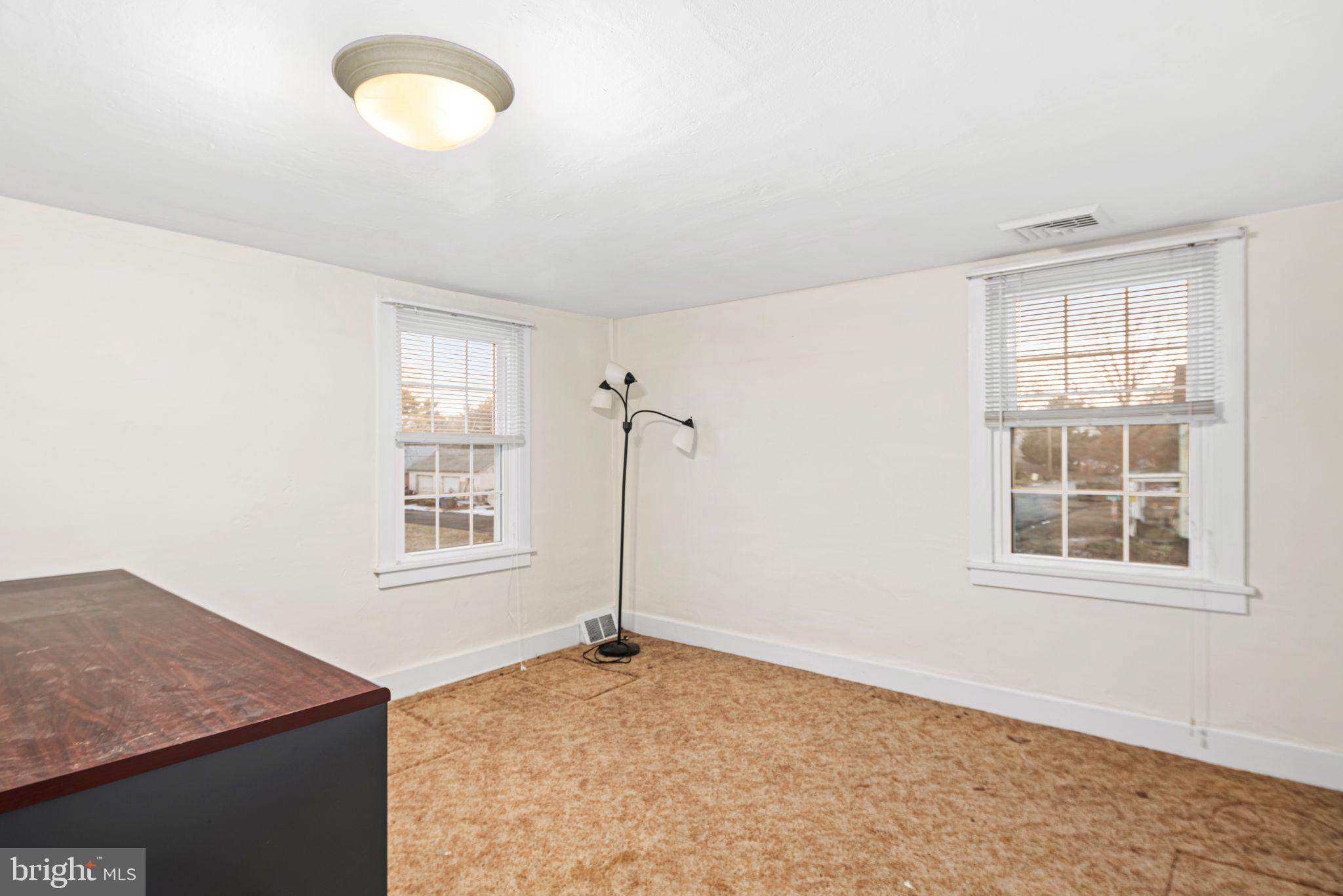 39 Main Street Pilesgrove, NJ 08098 - Photo 15 of 30 an empty room with windows