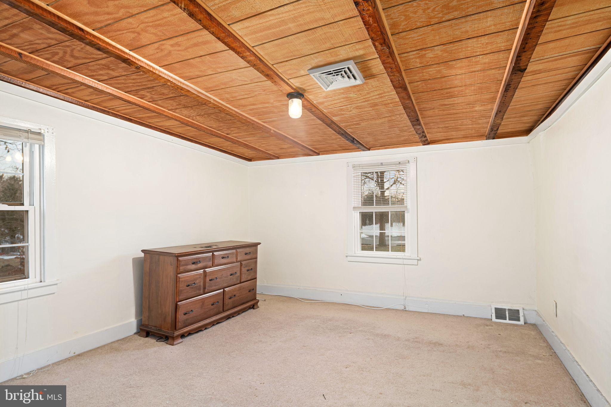 39 Main Street Pilesgrove, NJ 08098 - Photo 17 of 30 a view of room with furniture and window