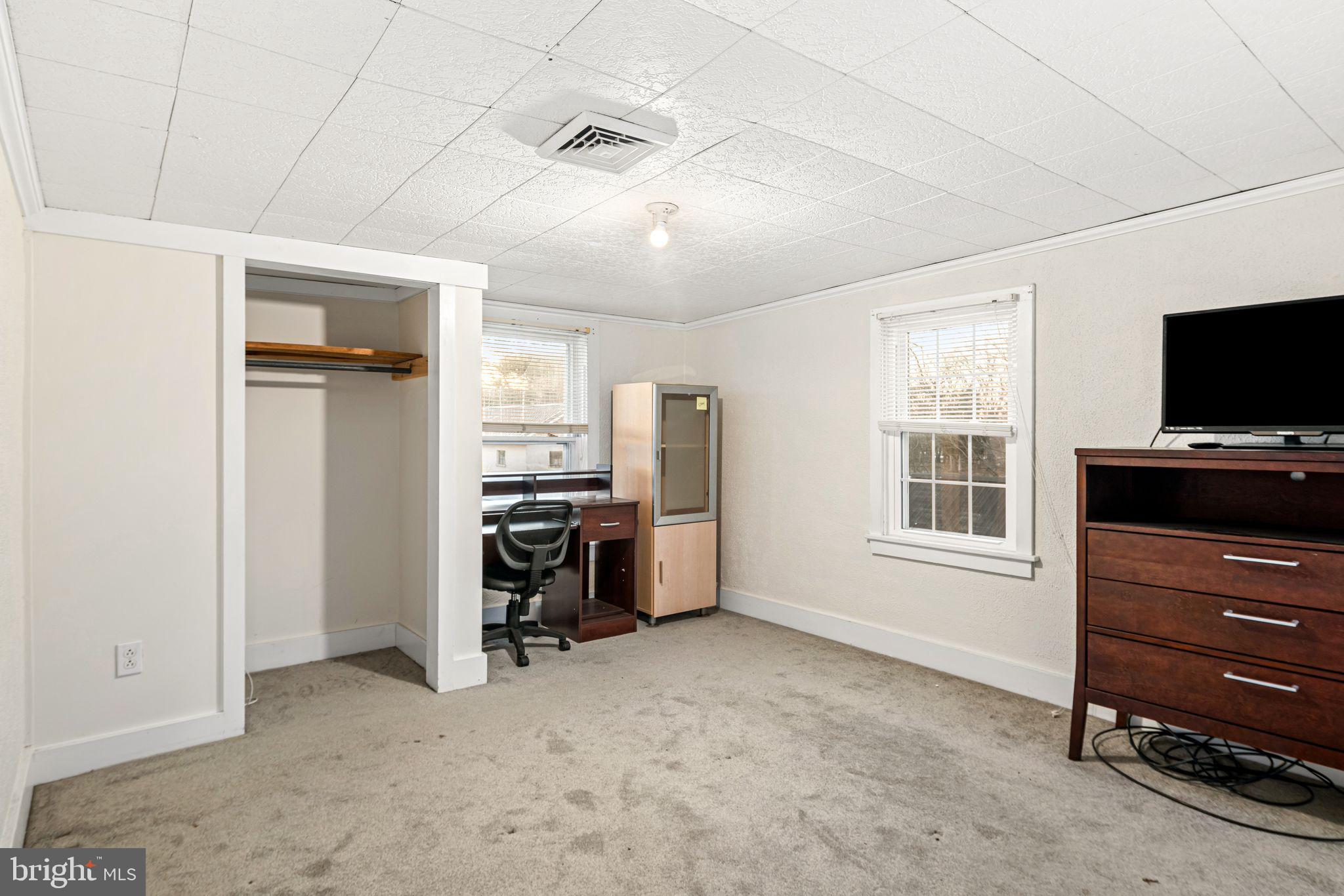 39 Main Street Pilesgrove, NJ 08098 - Photo 19 of 30 a view of a workspace with furniture and a window