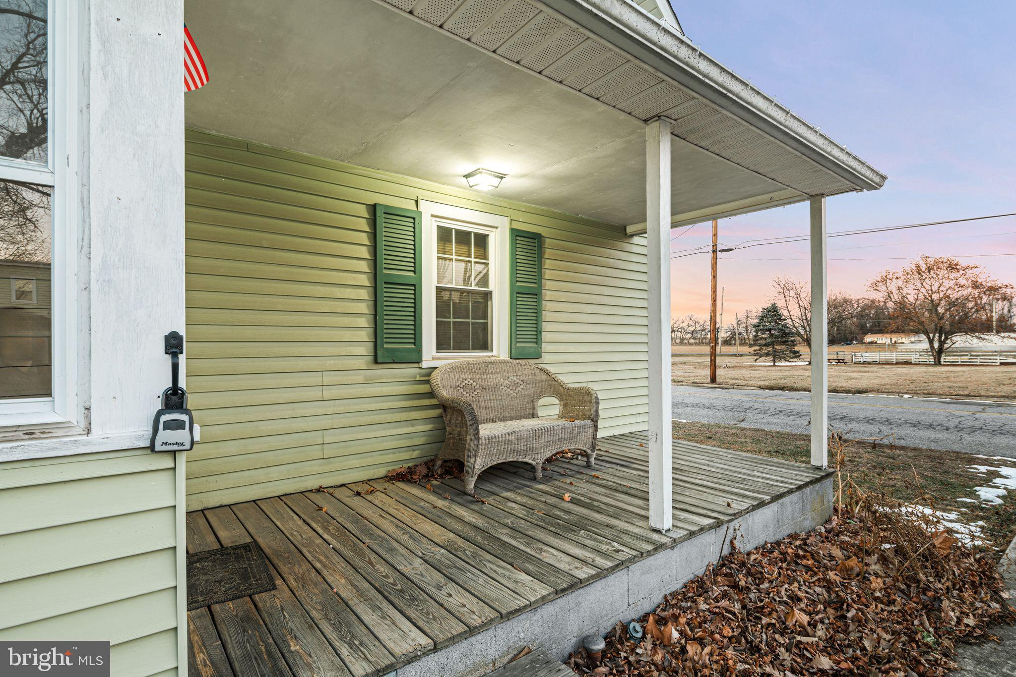 39 Main Street Pilesgrove, NJ 08098 - Photo 3 of 30 a view of a deck with chairs and wooden floor